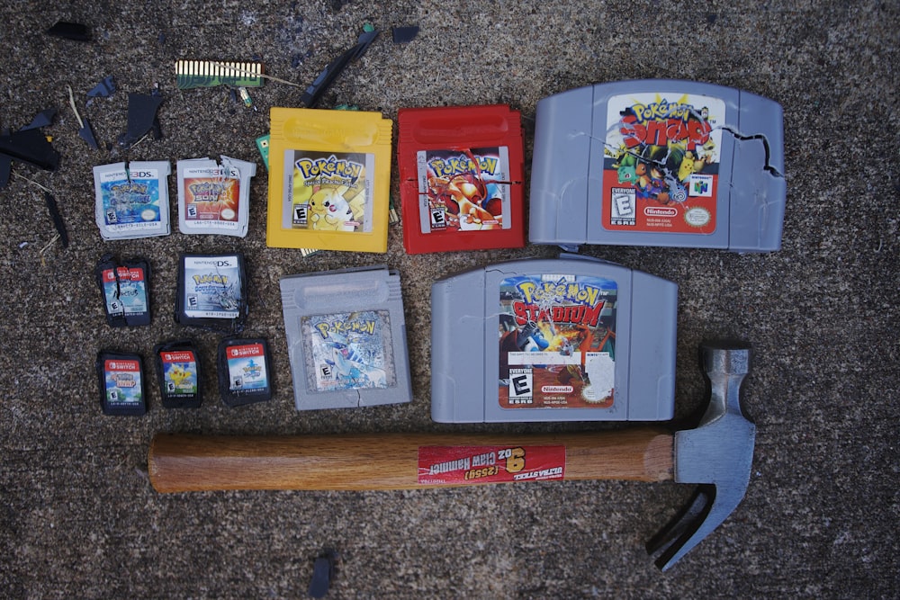 a collection of nintendo games and tools laid out on the ground