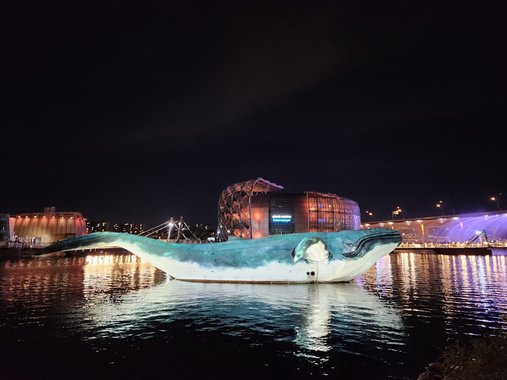 a sculpture of a whale in the water