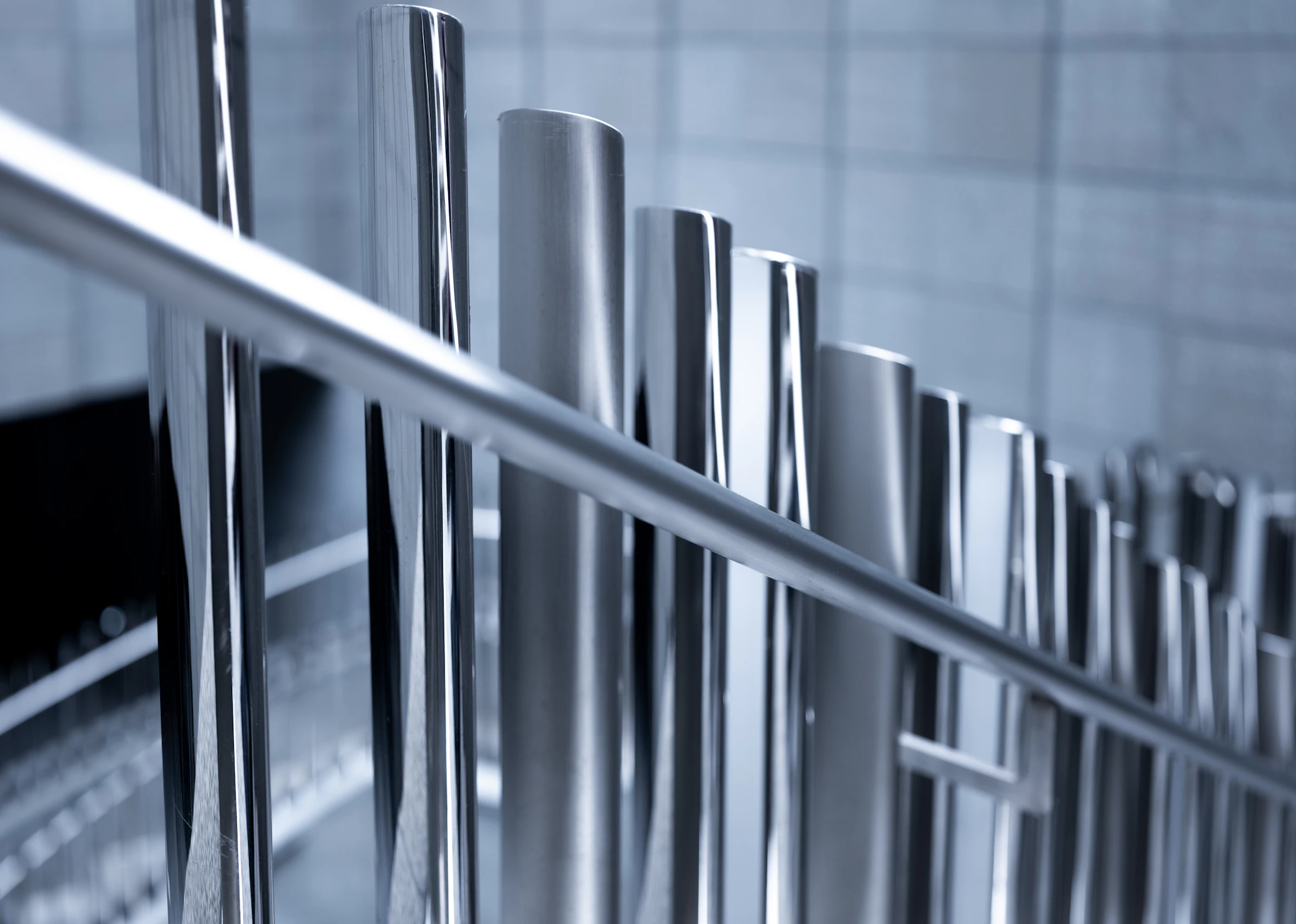Multiple polished solid round steel bars arranged together