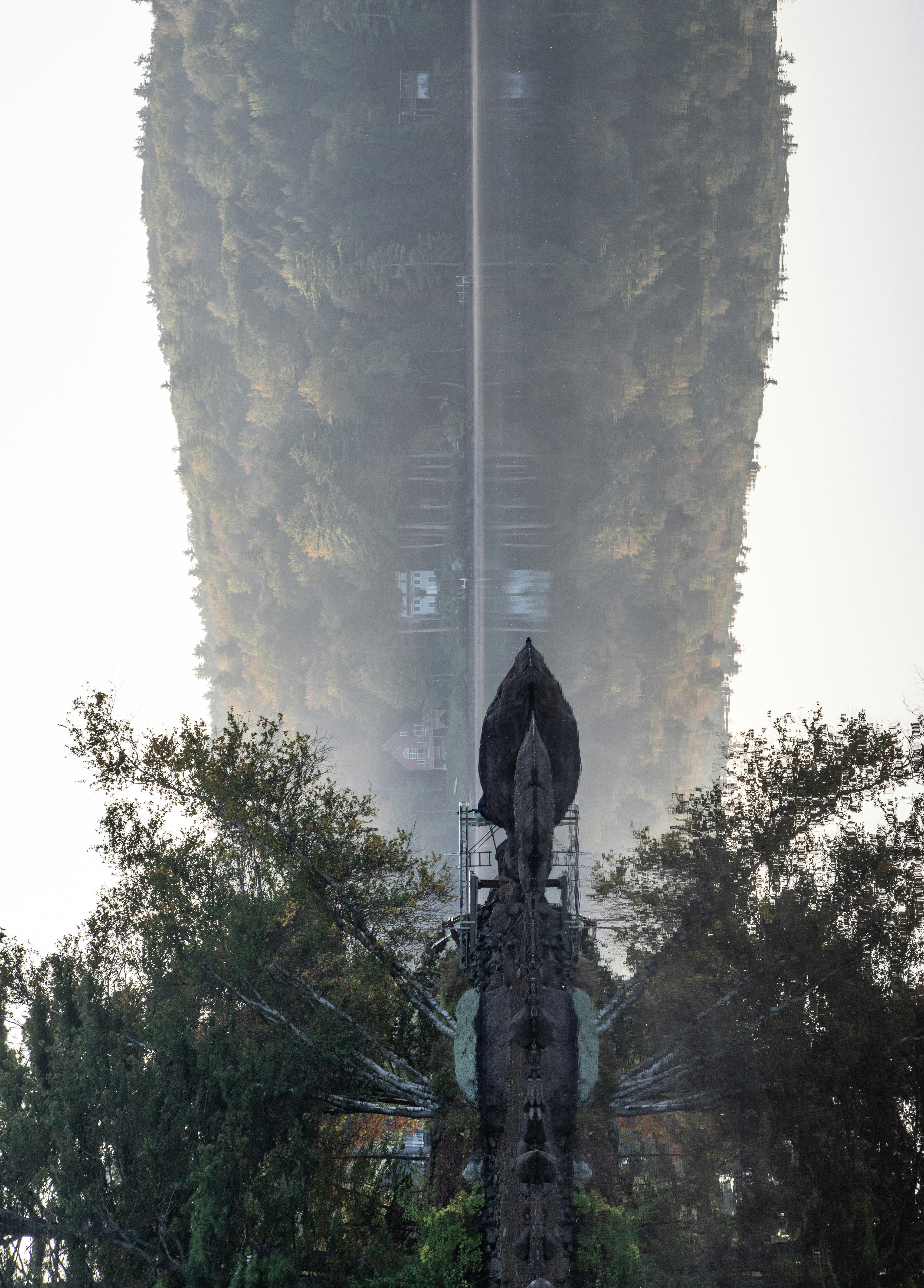 a very tall building with a very tall tower in the background