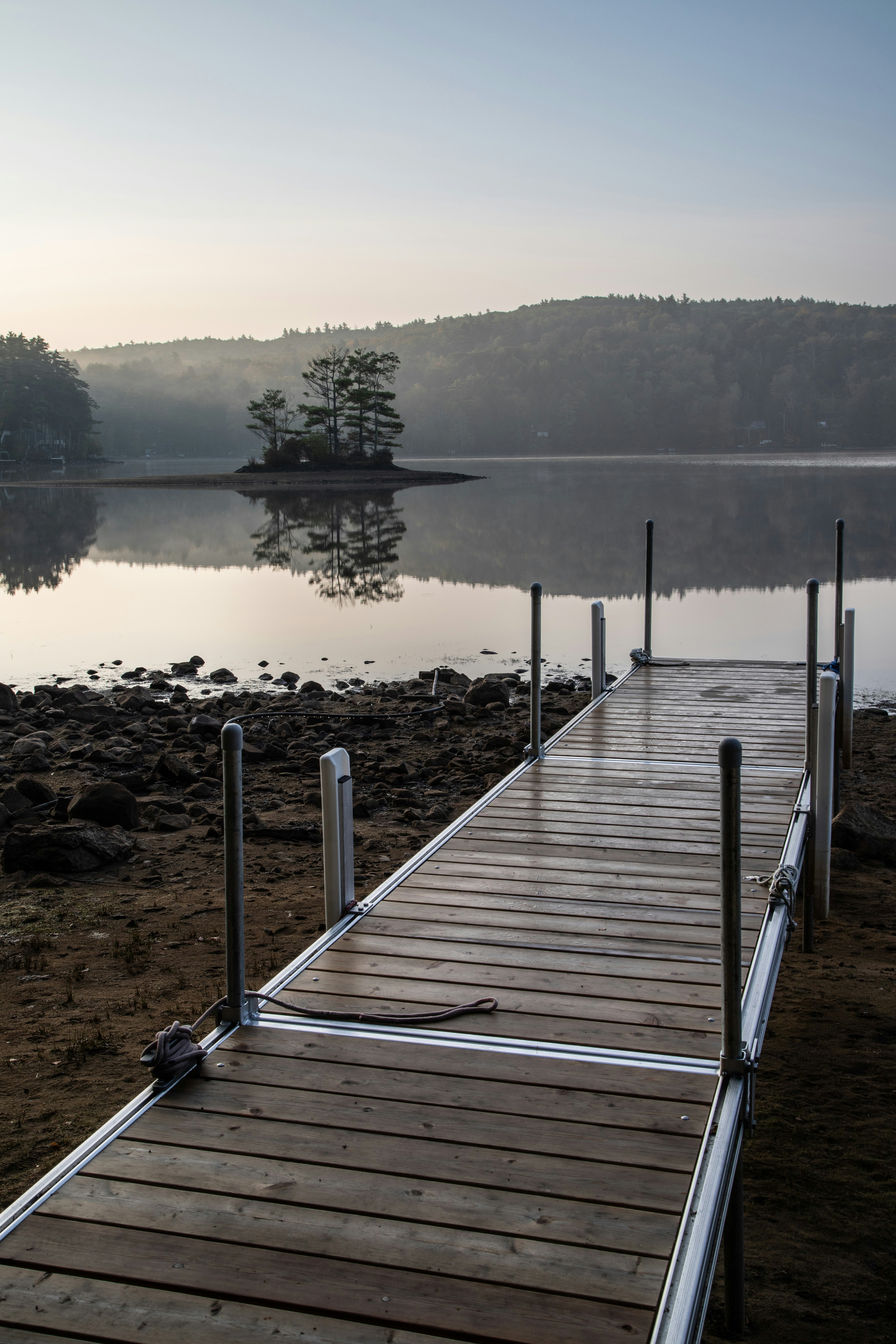 a wooden dock sitting next to a body of water