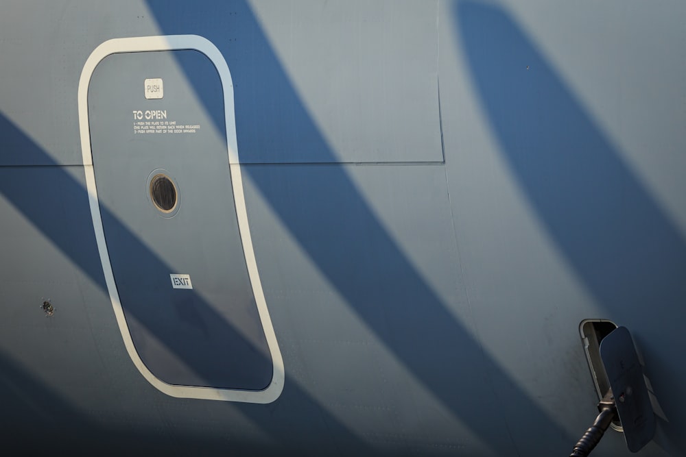 a close up of a gas pump on the side of a plane
