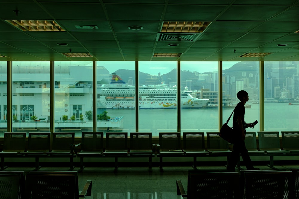 a person standing in front of a large window