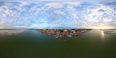 A panoramic view of the delta’s waterways with boats cruising and birds flying overhead.