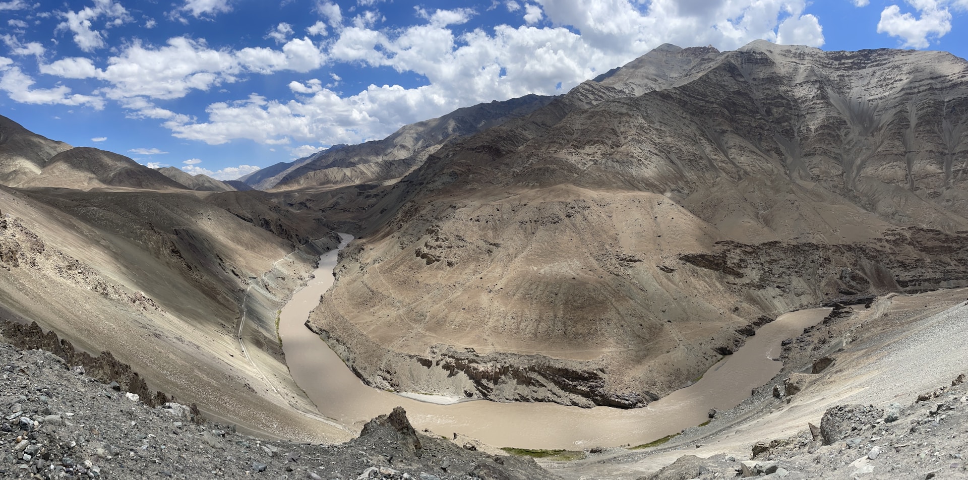 woman wearing yellow long-sleeved dress under white clouds and blue sky during daytime