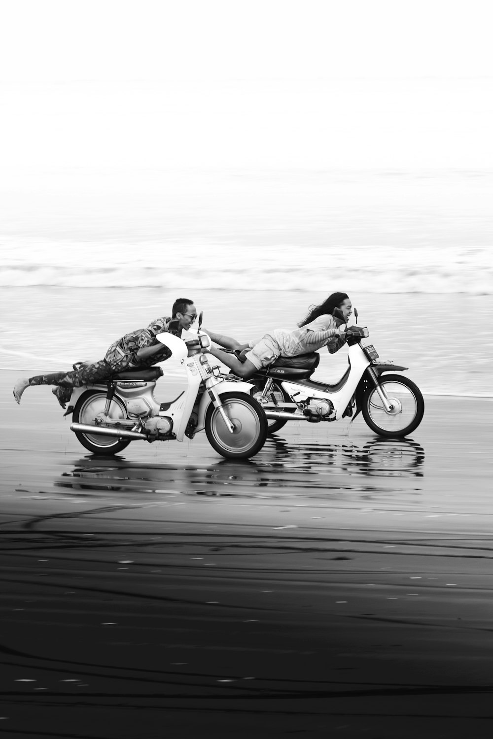 a couple of people riding on the back of a motorcycle