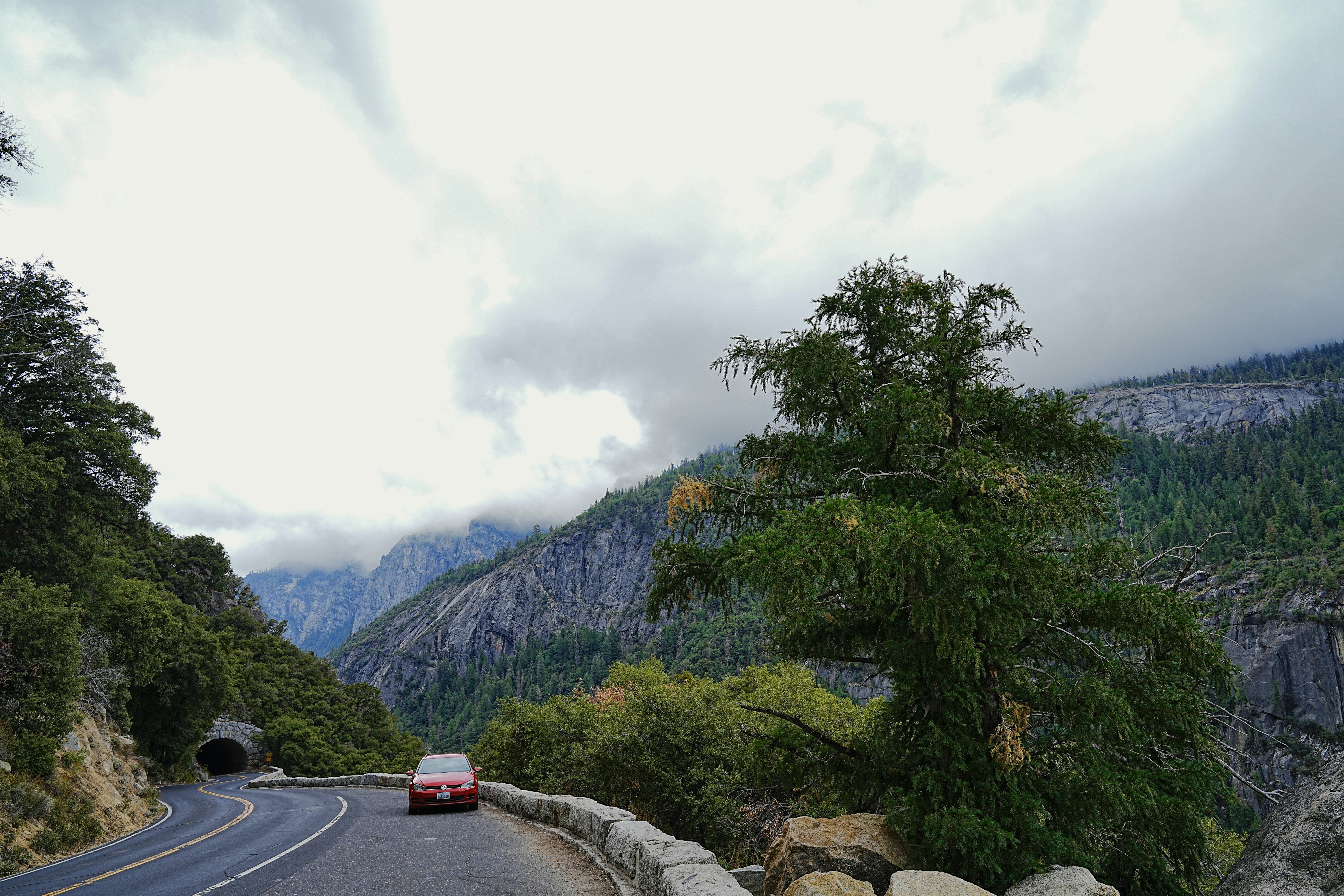a car is driving down a mountain road