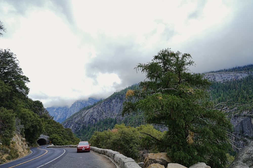 a car is driving down a mountain road