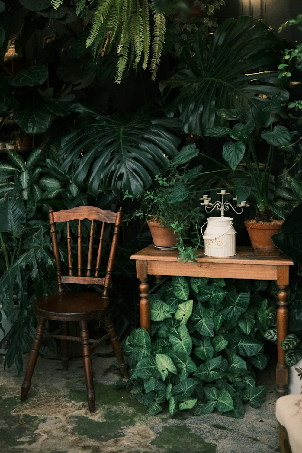 a wooden chair sitting next to a wooden table