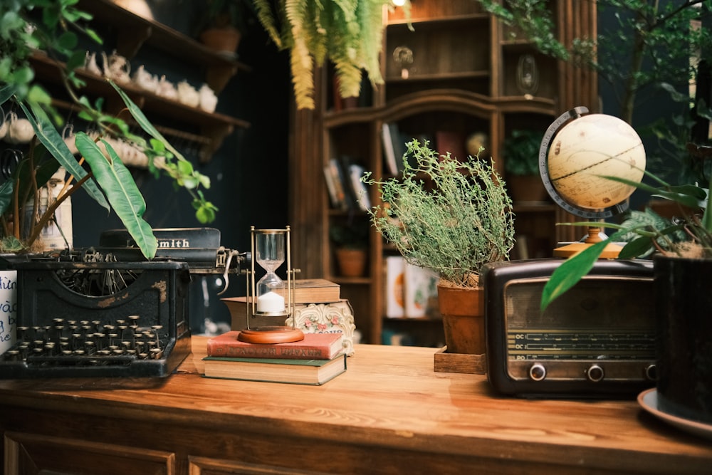 a table topped with books and a typewriter