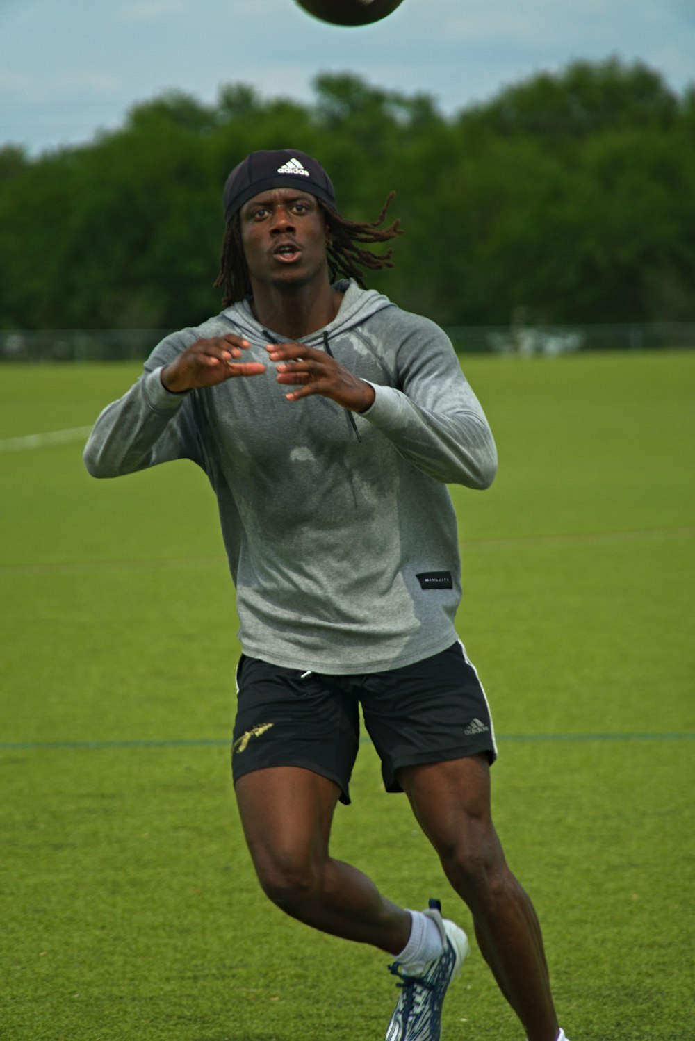 a man is playing frisbee in a field