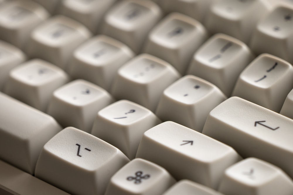 a close up of a white computer keyboard