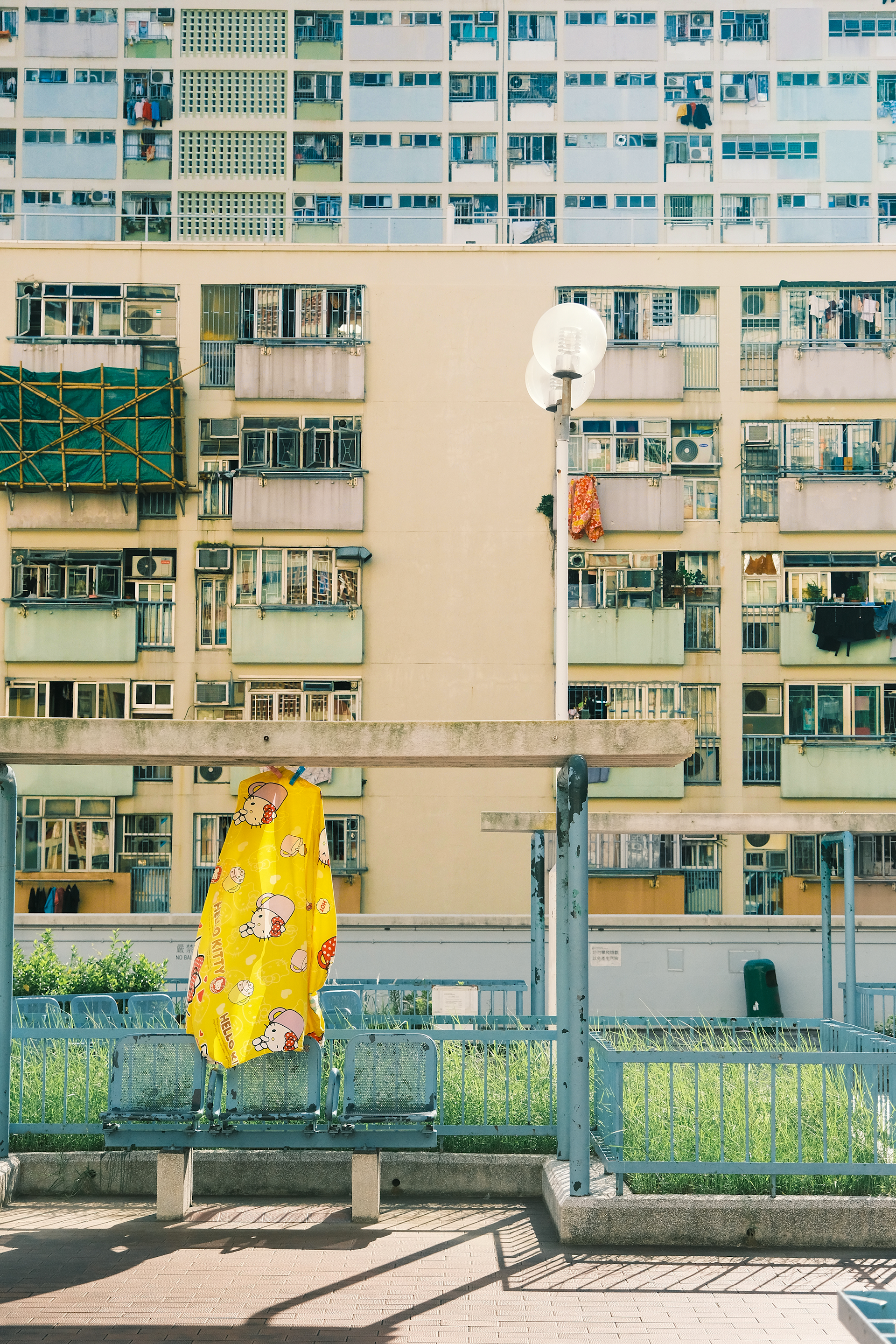 woman wearing yellow long-sleeved dress under white clouds and blue sky during daytime