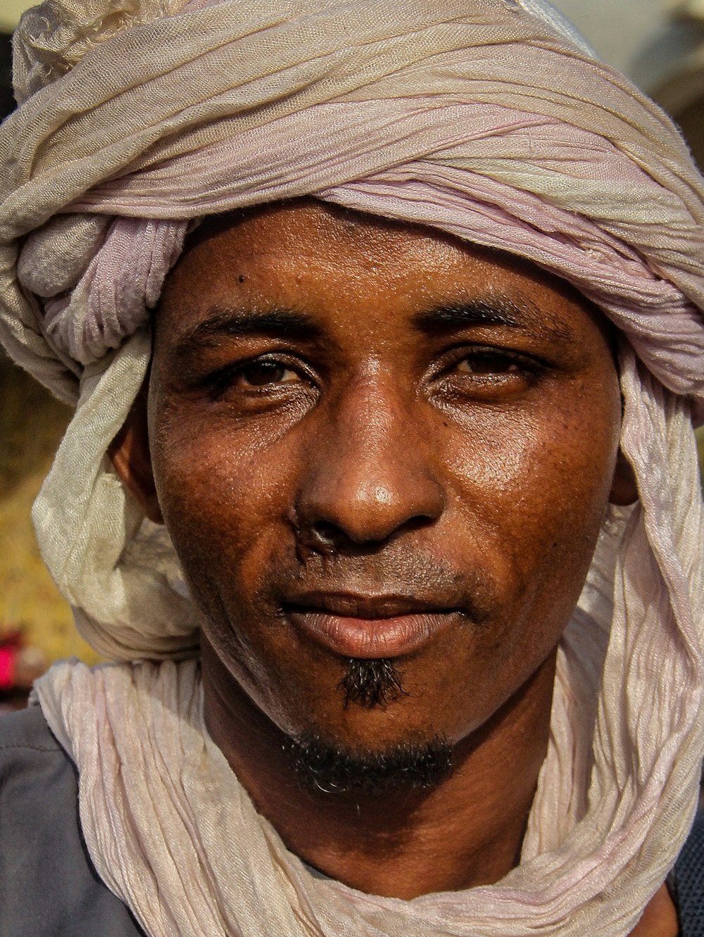 a man with a white turban on his head