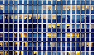 Elegant office building facade with glass windows.