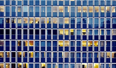 Elegant office building facade with glass windows.