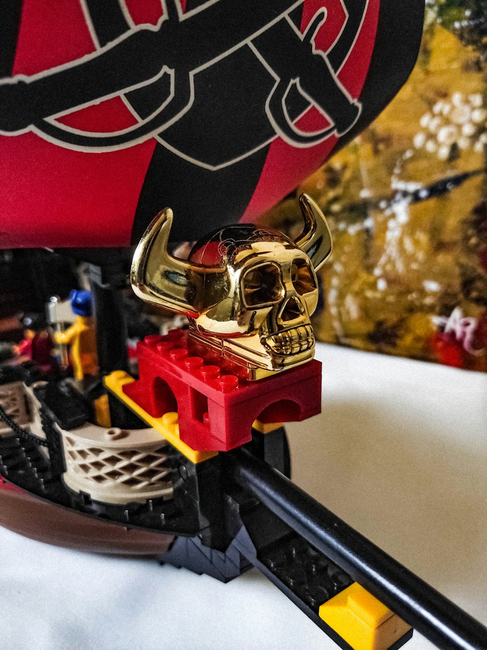 a close up of a toy boat with a skull on it