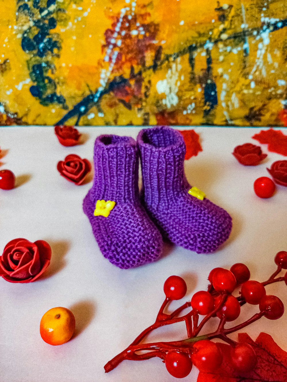 a close up of a pair of purple knitted shoes