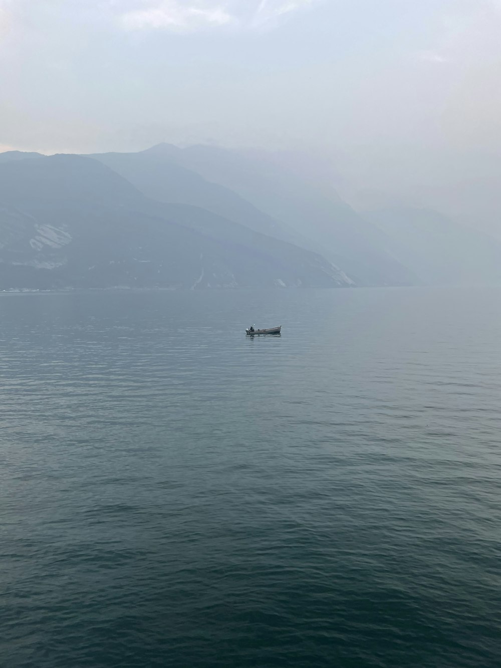 a boat floating on top of a large body of water