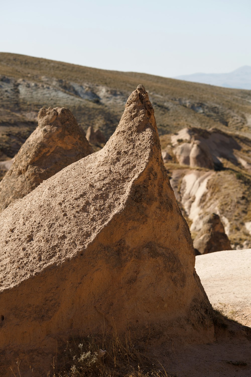 a rock formation in the middle of a desert