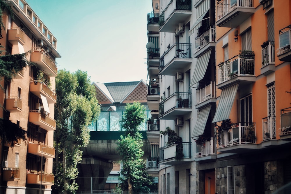 a city street with tall buildings next to each other