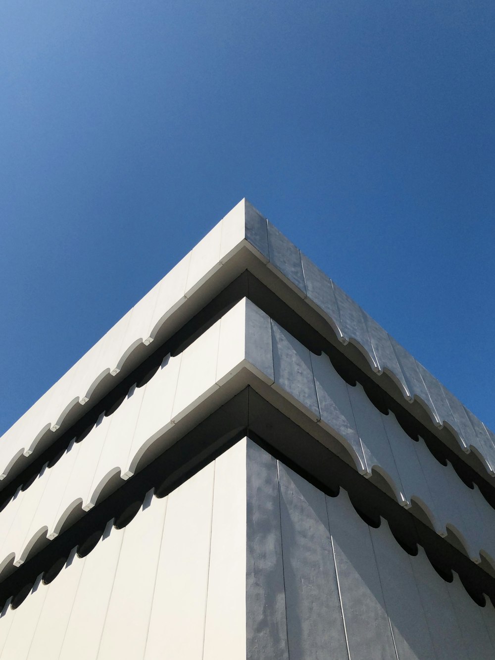 a tall building with a blue sky in the background