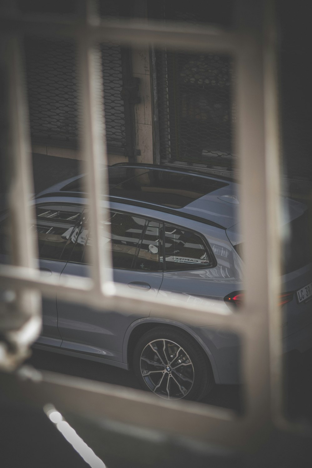 a car parked in front of a window