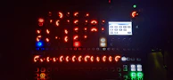 An interactive web app interface with glowing buttons and fluid animations on a minimalist dark screen.