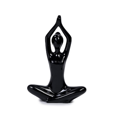 A shiny black sculpture of a human figure in a seated yoga pose, with legs crossed and arms raised above the head, creating a graceful and abstract representation of meditation or tranquility.