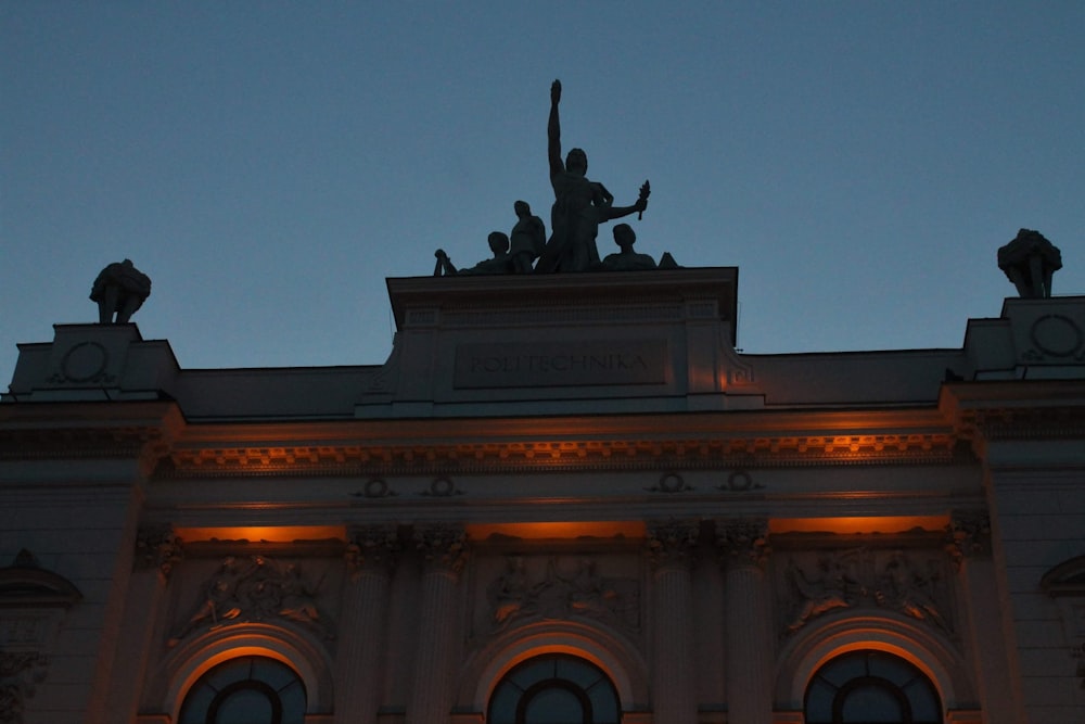 a building with a statue on top of it