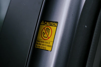 a caution sign on the side of a vehicle