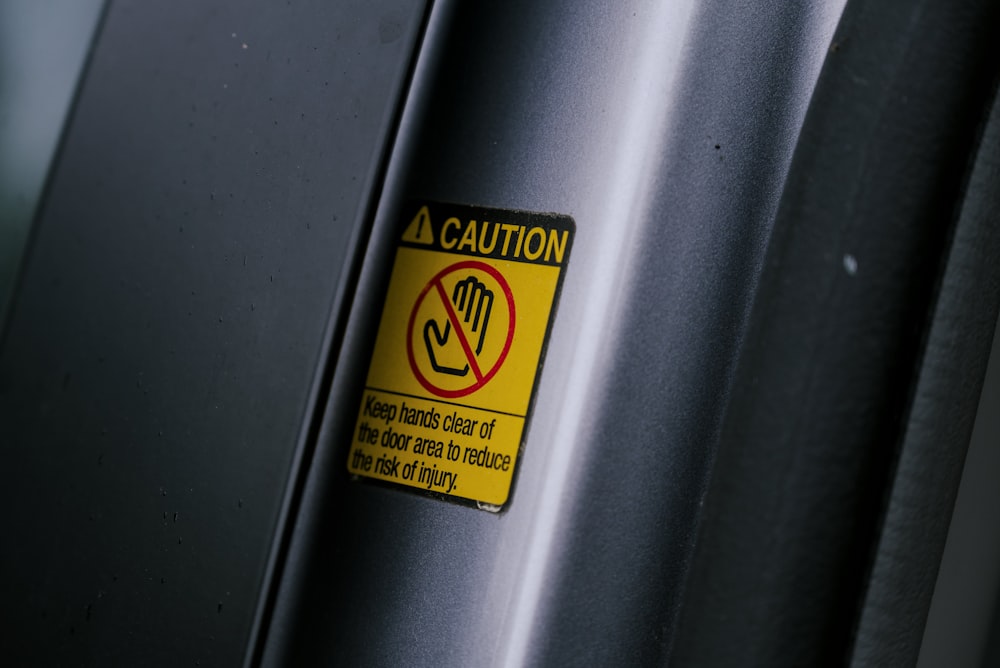 a caution sign on the side of a vehicle