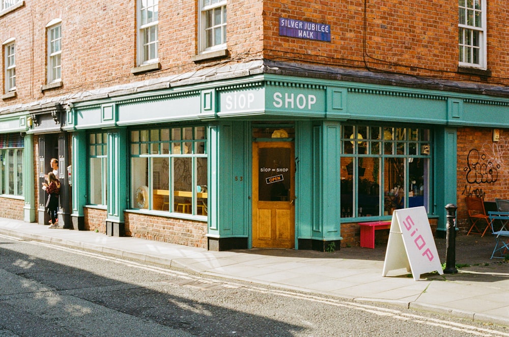 a store front with a sign in front of it