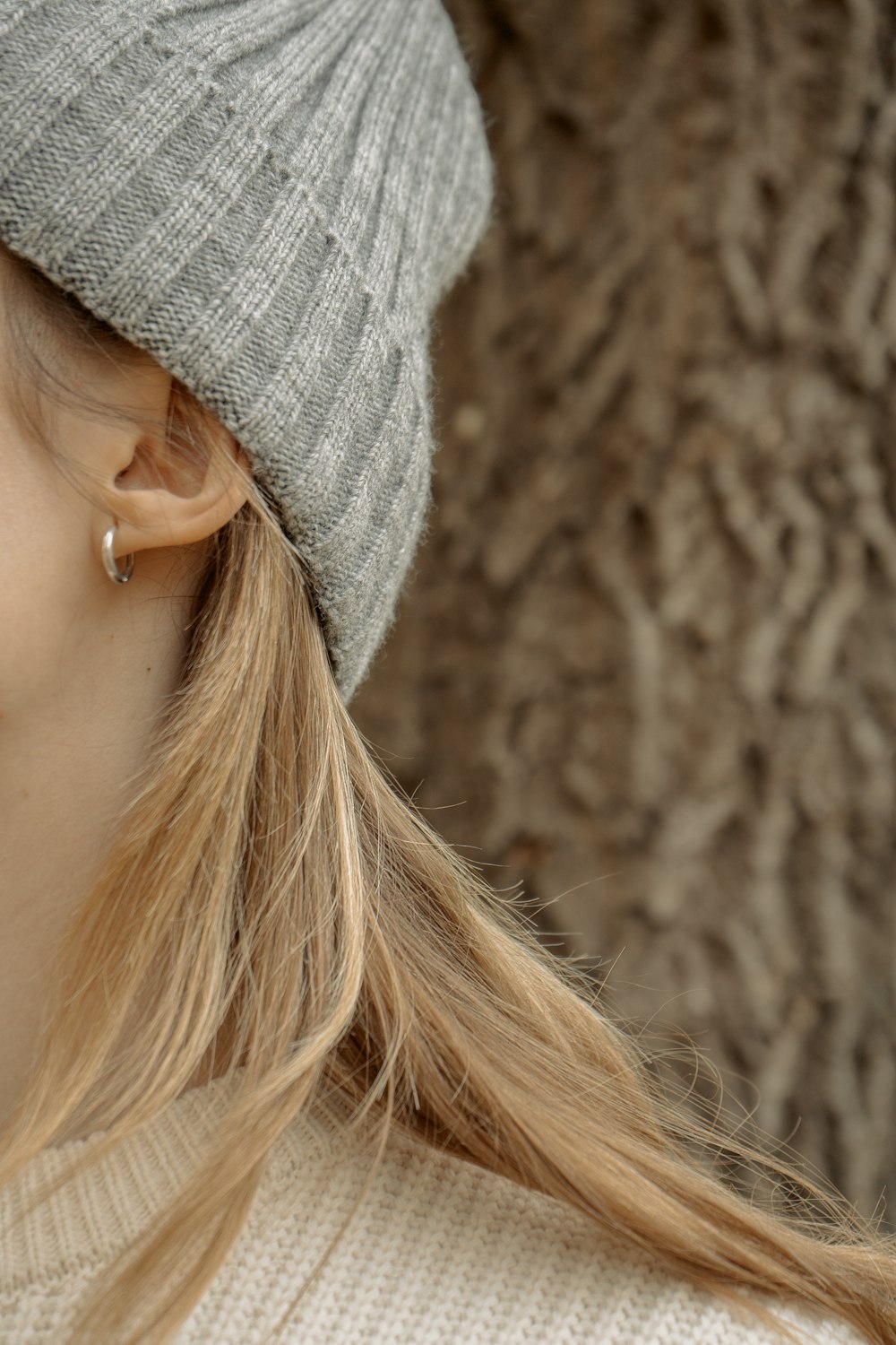 a close up of a person wearing a hat