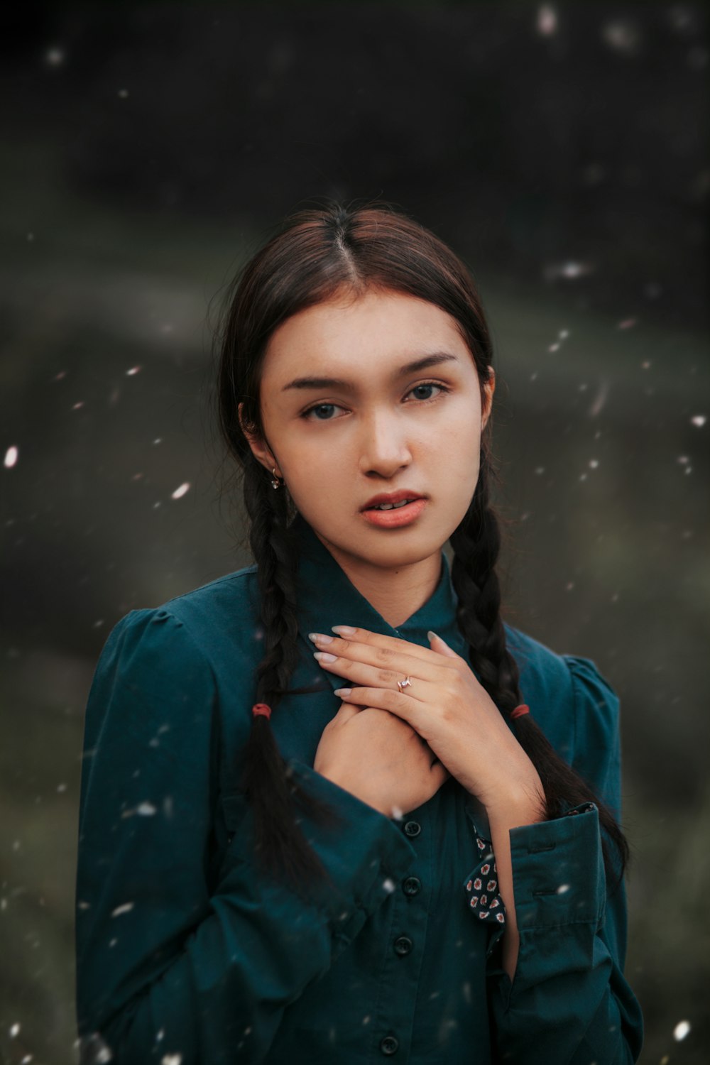 a woman with a braid standing in the snow