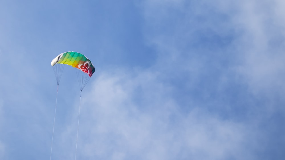 a colorful kite flying in a blue sky