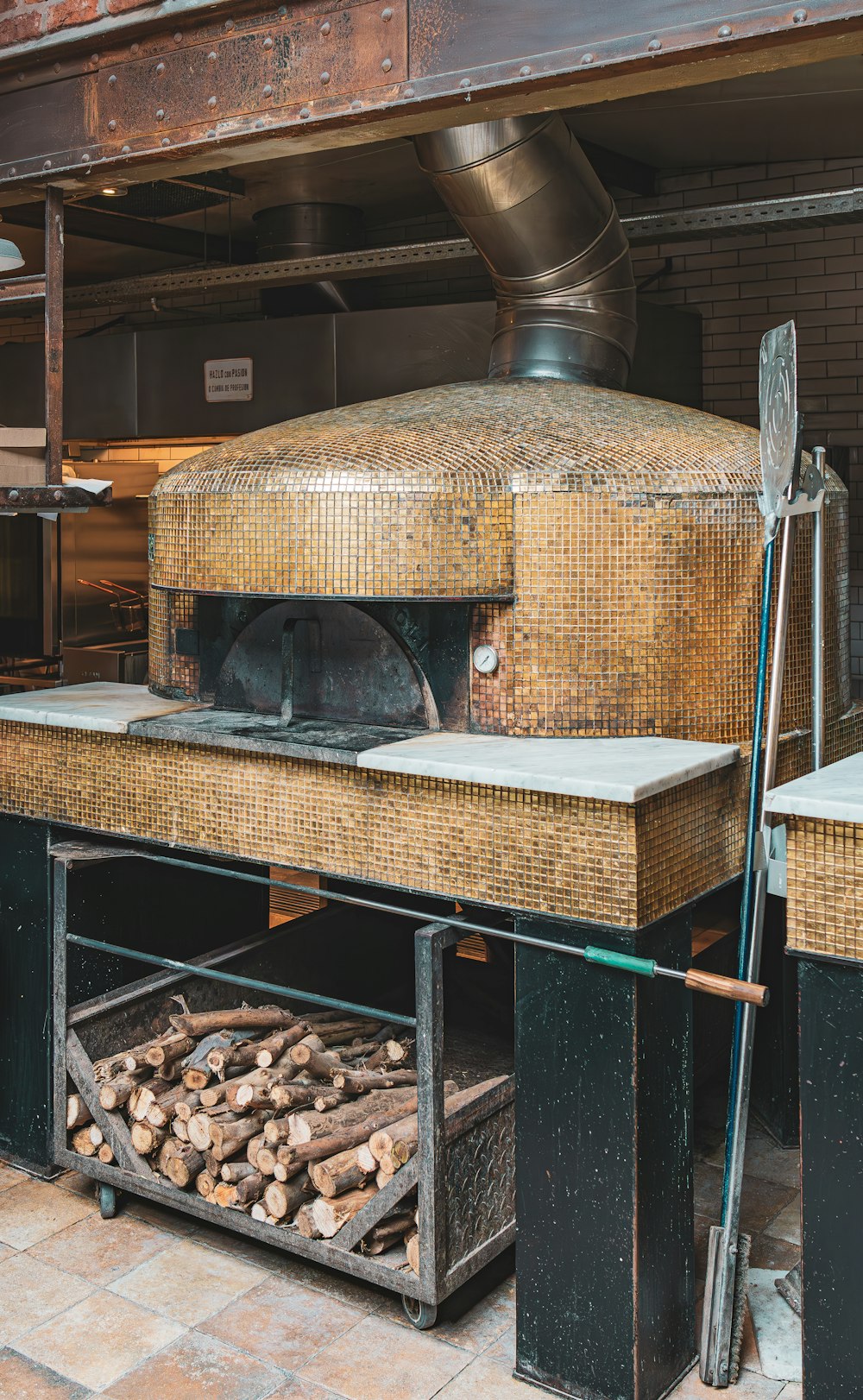 a large brick oven sitting inside of a kitchen