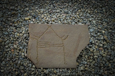 An ancient symbol carved in stone, representing gnóstica anthropology and mystery.