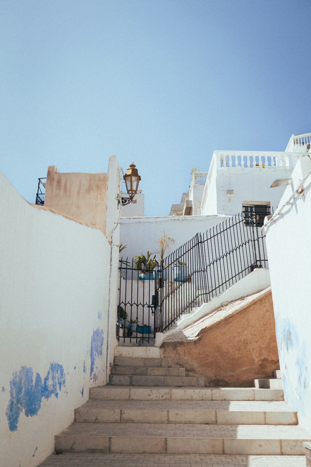 a staircase leading up to a white building