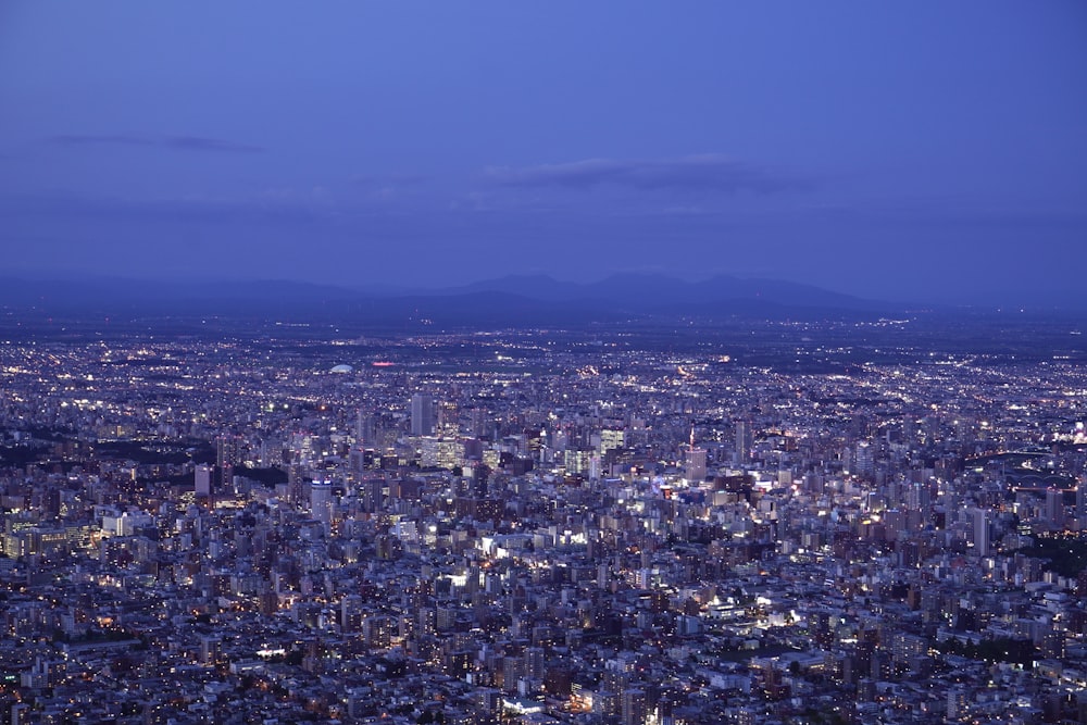 a view of a city at night from the top of a building