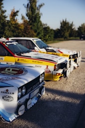 a group of cars parked next to each other in a parking lot