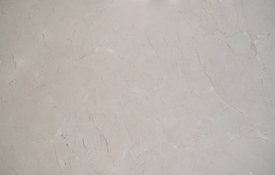 Close-up of a sleek marble countertop with subtle gray veins in a modern kitchen setting