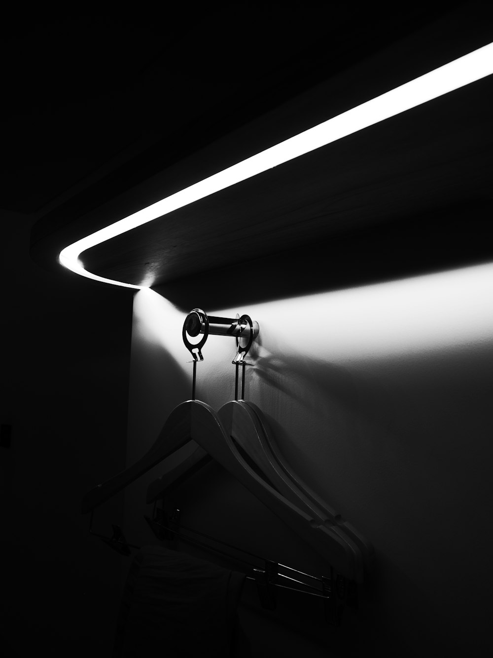 a black and white photo of a bathroom light