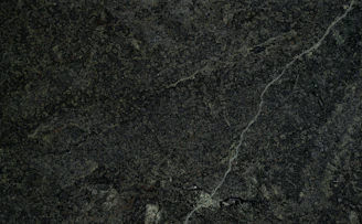 Textured mineral surface reflecting resilience and strength under pressure.