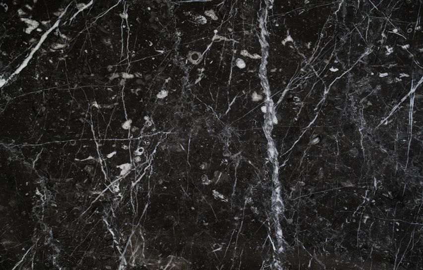 A smooth, polished quartz slab with soft white and gray veining, perfect for modern kitchen countertops.