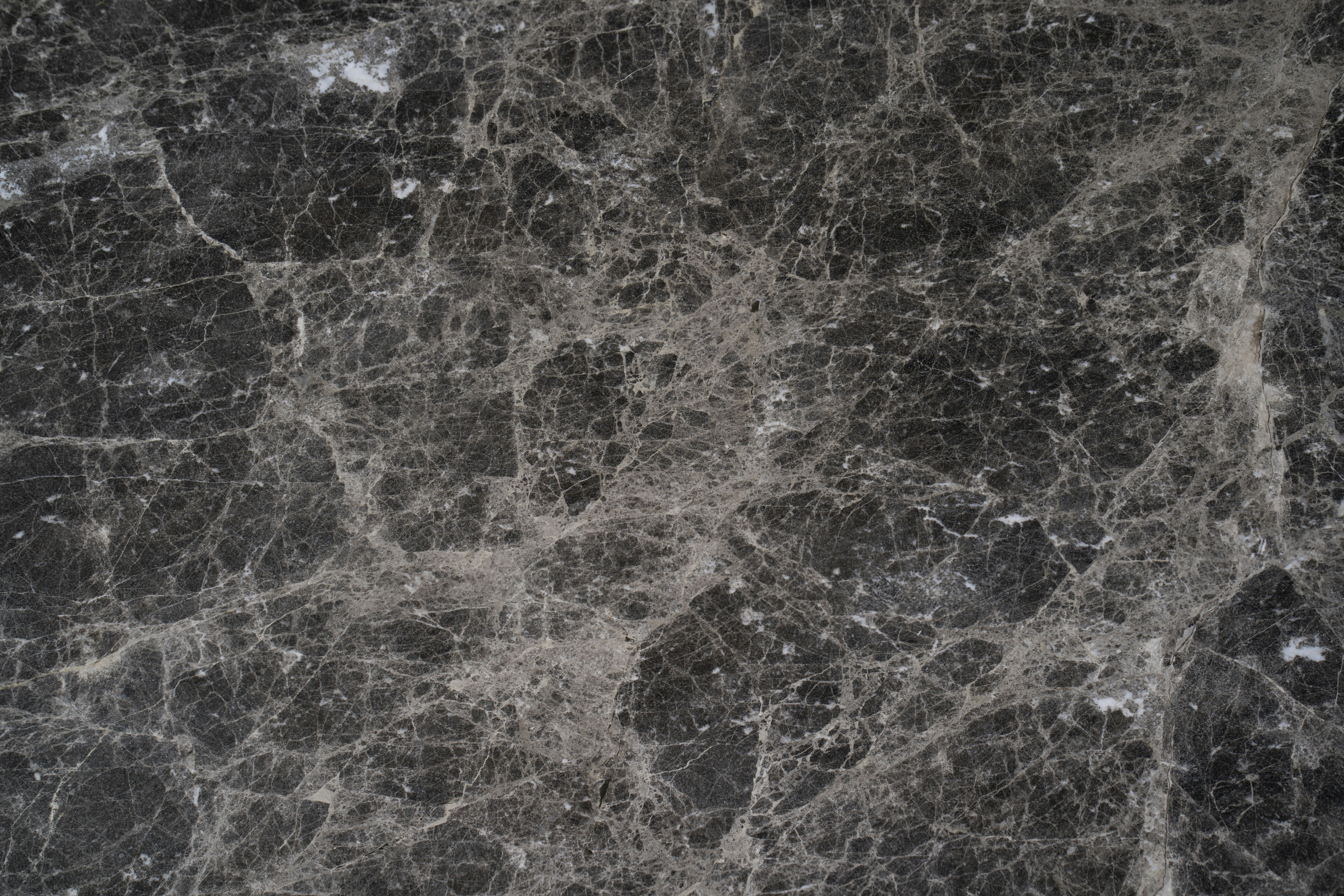 Dark marble texture background, deep black stone with subtle grey veining