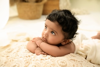 A baby undergoing treatment for torticollis with gentle exercises.