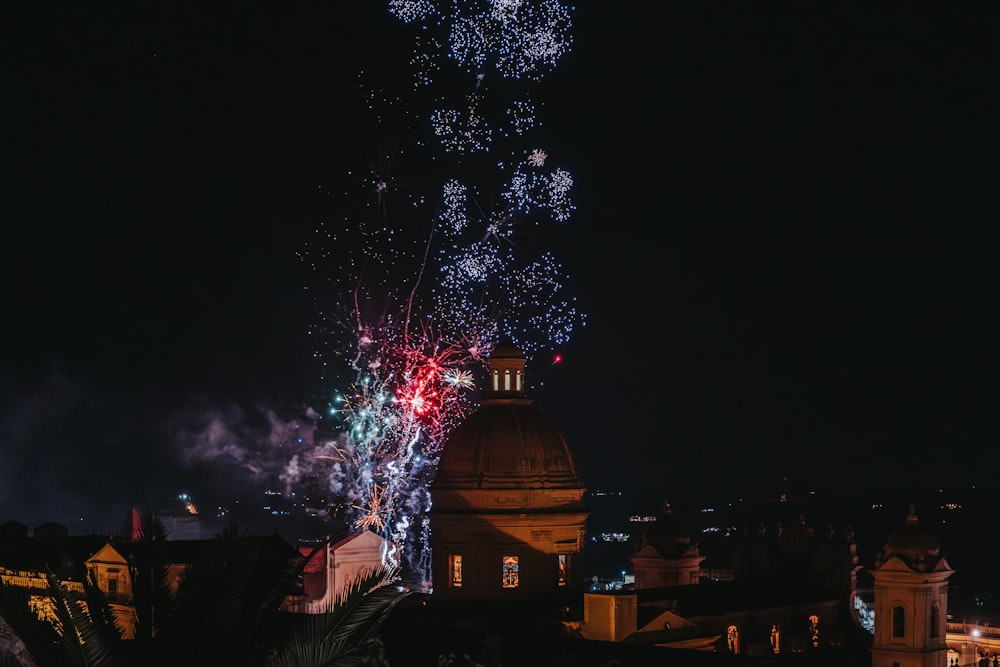 fireworks are lit up in the night sky