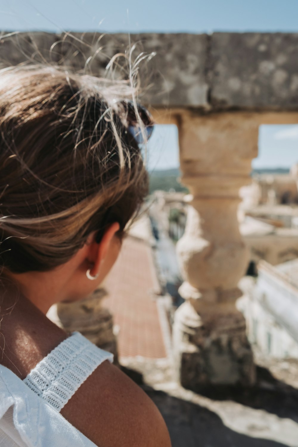 a woman with her hair in a pony tail