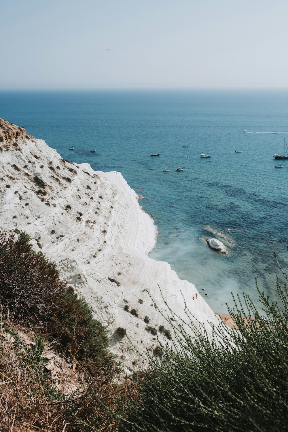 a body of water with boats in the distance